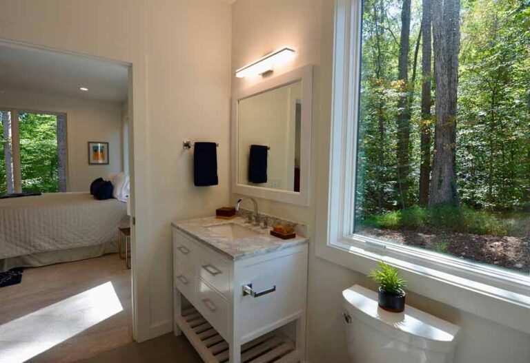 Picture of a house in Durham, NC that shows the bathroom, bedroom, and lighting done by MSS Ortiz.