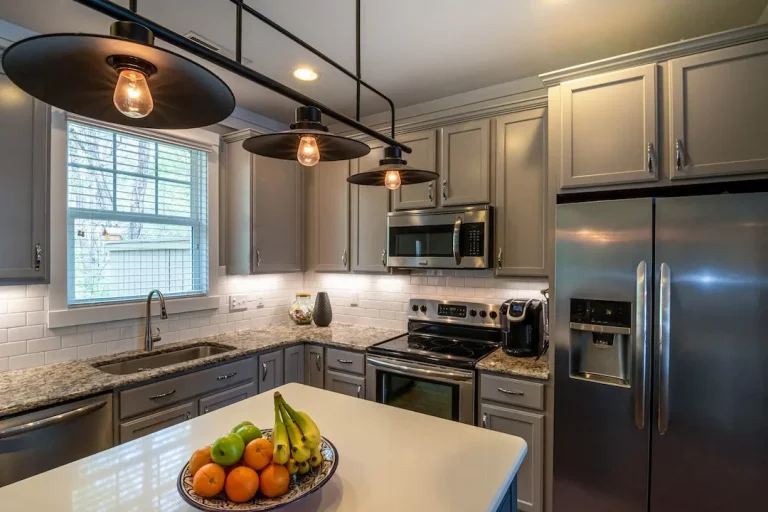 Picture of a kitchen with a modern lamp hung by professional lighting fixture installation in Raleigh Durham.