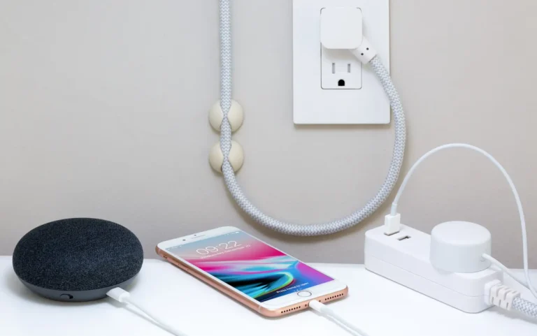 Picture of an outlet with devices plugged in an charging for the blog about how to wire an outlet